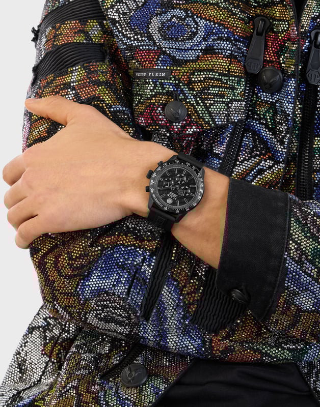 This Philipp Plein Pleinmeter Chronograph Watch for Men is the perfect timepiece to wear or to gift. It's Black 44 mm Round case combined with the comfortable Black Silicone watch band will ensure you enjoy this stunning timepiece without any compromise. Operated by a high quality Quartz movement and water resistant to 5 bars, your watch will keep ticking. Elevate your style with the Pleinmeter, a chronograph timepiece with an ultra-sporty design that is synonymous with unparalleled performance. This Chronograph watch has a  function: Stop Watch , 24-hour Display and Tachymeter High quality 21 cm length and 21 mm width Black Silicone strap with a Buckle Case diameter: 44 mm,case thickness: 11 mm, case colour: Black and dial colour: Black
