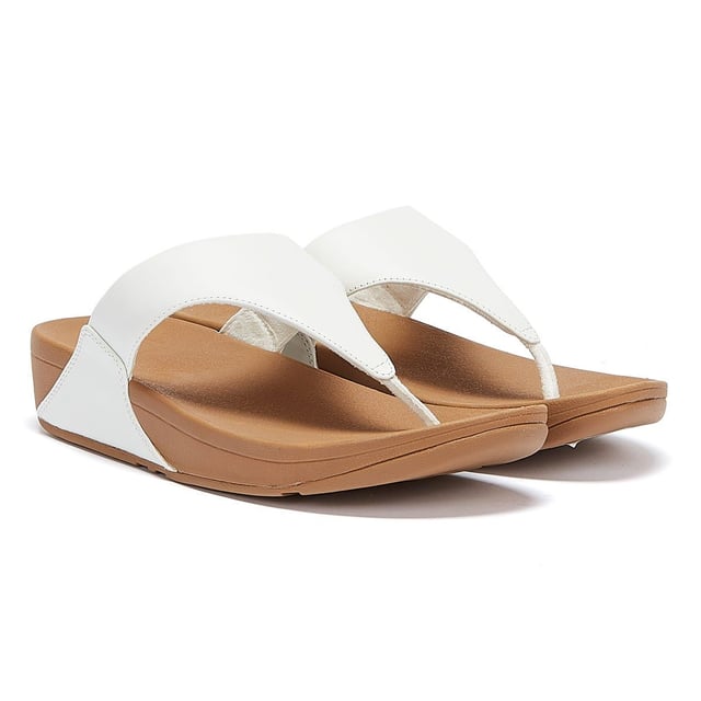 The minimalist Lulu sandals from FitFlop feature a timeless fabric-lined triangular vamp, along with legendary ergonomic Microwobbleboard™ midsoles, which deliver extraordinary comfort by not only absorbing shock but by diffusing underfoot pressure. This iteration boasts softly padded leather uppers for a classic finish.