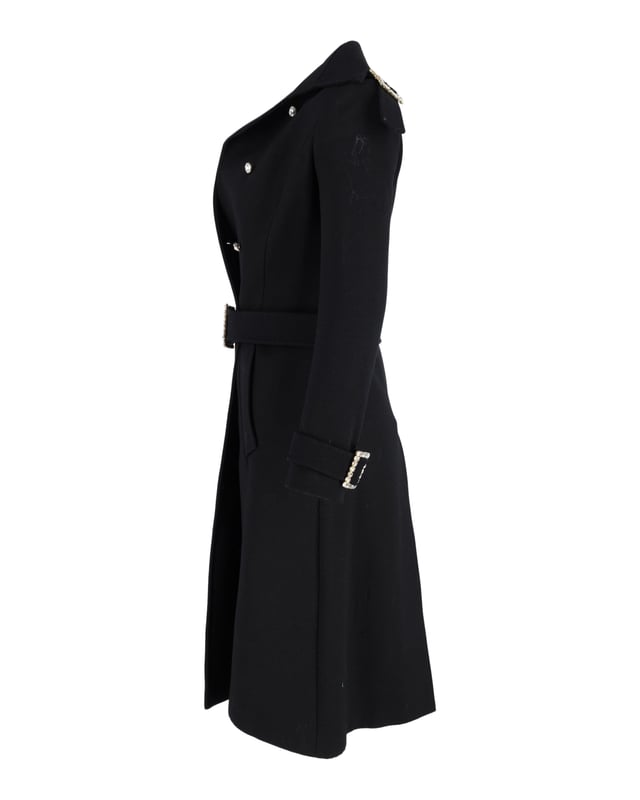VINTAGE, RRP AS NEW
Experience the epitome of luxury with the Dolce & Gabbana Double-Breasted Coat with Belt in Black Wool, a statement-making piece that exudes elegance and refinement. Crafted from the finest black wool, this coat features a classic collar, crystal buttons, long sleeves, and pockets for practicality, while the belt cuffs with crystal buckles add a touch of glamour and sophistication. The exquisite animal print lining adds a luxurious and unique touch, making this coat a must-have for those who appreciate the finer things in life.



Dolce & Gabbana Double-Breasted Coat with Belt in Black Wool
Condition: very good
Material:   Wool/Hair | Lana vergine
Size: EU40
Sign of wear: slight stains
SKU: 358075