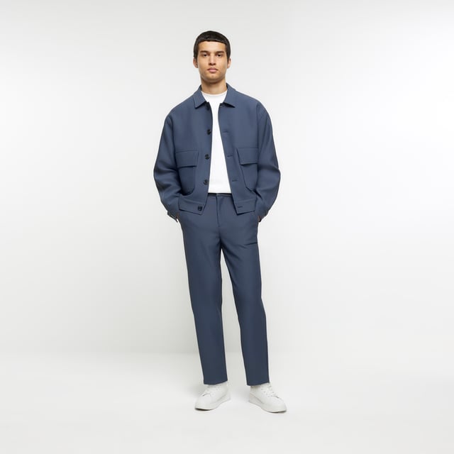 Tapered fit, Pleated fabric, Side slip pockets, Belt loops, Concealed zip and button fastening