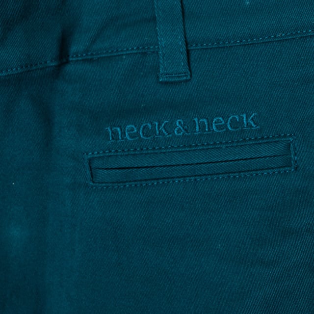 Long pants.
 Waistband with belt loops.
 Brand name embroidered under the waistband.
 Adjustable waistband with internal elastic.
 Button and zipper closure.
 Open pockets on the front.
 Open pocket on the back.
 Embroidered details on the back pockets.
 Composition: 100% cotton
 Care:
- Wash at max. 30ºC.
 - Do not use bleach.
 - Iron at low temperature.
 - Supports dry cleaning.
 - Do not use dryer.
