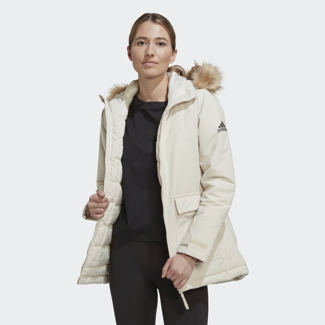 Nothing is the same two days in a row. Not in nature. Not in the city. Be prepared for all the weather shifts in this adidas parka. Padded for warmth, this do-it-all jacket also has adjustable cuffs and a cosy hoodie to help keep the cold out. Removable faux-fur trim lets you customise the look.This product is made with recycled content as part of adidas' ambition to end plastic waste.  - This model is 175 cm and wears a size S. Their chest measures 81 cm and the waist 60 cm. - Regular fit - Full zip with hood - Shell: 100% nylon plain weave with durable water-repellent (DWR) coating - Fill: 100% recycled polyester padding - Front patch pockets - Hook-and-loop adjustable cuffs  Shipped by adidas