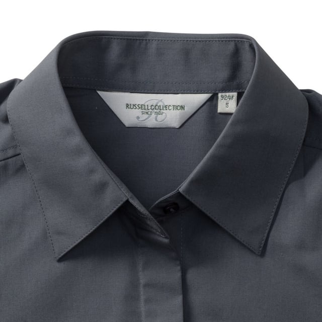 One of the great classic shirt fabrics, combining elegance with durability and wearer comfort. Smart and stylish fitted shirt design in a fine poplin fabric. Concealed placket. Stylish yoke design. Darts on bust front hem and back panel for fitted shape. Decorative top stitch on darts. Modern rounded 2 button cuffs. Rounded hem. The elegant lightweight fabric is especially suited for finer embroideries. Also available in mens sizes, code 924M. Weight: 110- 115g/m². Fabric: 65% Polyester, 35% Cotton. XS (30-32: To Fit (ins), 8: Dress Size). S (32-34: To Fit (ins), 10: Dress Size). M (34-36: To Fit (ins), 12: Dress Size). L (36-38: To Fit (ins), 14: Dress Size). XL (38-41: To Fit (ins), 16: Dress Size). 2XL (41-44: To Fit (ins), 18: Dress Size). 3XL (44-47: To Fit (ins), 20: Dress Size). 4XL (47-51: To Fit (ins), 22: Dress Size). RUSSELL COLLECTION - a variety of Mens and Womens corporatewear in a wide range of styles, colours and sizes.