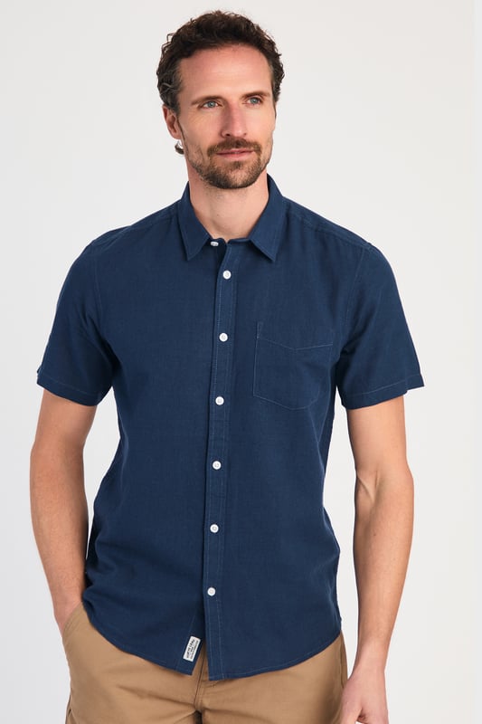 Blue Linen Blend Short Sleeve Button-Up Shirt With Chest Pocket Upgrade your summer wardrobe with this short-sleeved, linen shirt from Tokyo Laundry. Made from a breathable blend of linen and cotton, this shirt offers comfort and style with its classic fit. The shirt features button fastening and a chest pocket. Machine washable for easy care.