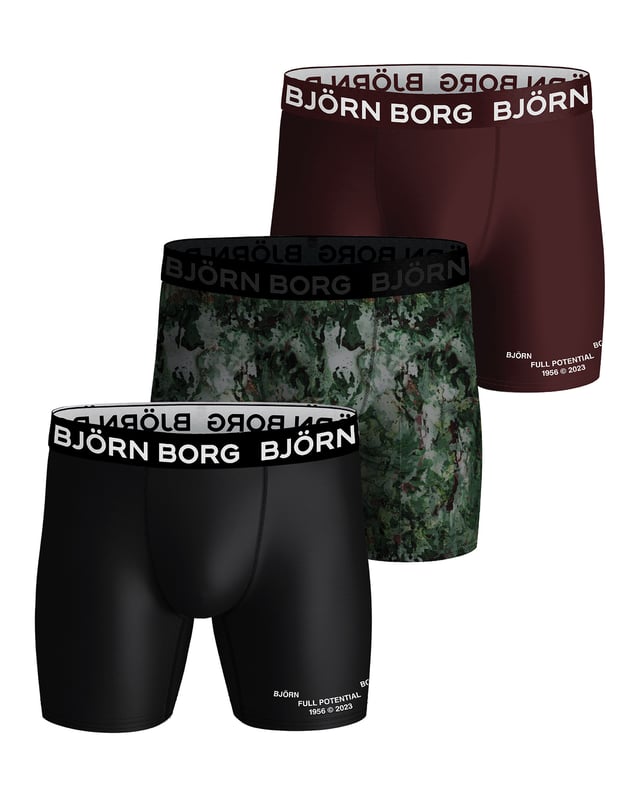 Björn Borg - 3 Pairs of Performance Boxers for MenFor your performance needs, look no further than Björn Borg Men’s Boxers. The perfect solution for your underwear drawer. They have a great fit that will keep you comfortable throughout the day.These high performance underwear with the perfect fit are developed for training. They are made from a high quality performance fit fabric that is soft, moisture wicking and breathable. It is also 90% recycled, making it eco friendly.The medium leg length makes these Björn Borg boxers ideal for whatever sport or activity you get up to, while still giving you enough coverage to look stylish when you’re training in the gym or on a run.With smooth seams and elastic to avoid chafing, and an iconic signature soft elasticated waistband ensures a comfortable fit throughout your training sessions, while the mid rise and fabric blend provide extra support throughout your workout.These boxers are perfect for both work and play, making them an ideal choice for topping up that underwear drawer. They come in 2 mixed colour options which are: Black, Burgundy, Camo Mix & A Night Sky Mix.These boxers are made from: 90% Polyester (Recycled), 10% Elastane and come in 4 sizes: Small, Medium, Large & X-Large. They come in 3 pairs per pack, making them great value for money and they are Machine Washable.Extra Product DetailsBjörn Borg Men’s BoxersSuitable For Sport3 Pairs Per PackMoisture WickingPerformance FItMedium Leg LengthMid Waist RiseSoft Elasticated WaistbandGreat Value For Money2 Mix Colour Options90% Recycled PolyesterAvailable in: S, M, L & XLMachine Washable