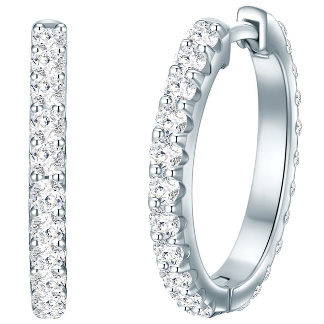 Glittering earrings belong in every jewelry box - like these creoles of the Trilani label. The design convinces with a timeless circular shape. Made of 925 sterling silver and with a rhodium line, the earrings keep their cool silver gloss for a long time. Eyecatcher is the lush trim with zirconia crystals, whose diamond grinding ensures a beguiling sparkle on your earlobes. The creoles have what it takes to have an Everything-Piece, with an office look as well as in leisure time. A practical folding lock offers ideal wearing comfort and simplifies the attachment and taking off.