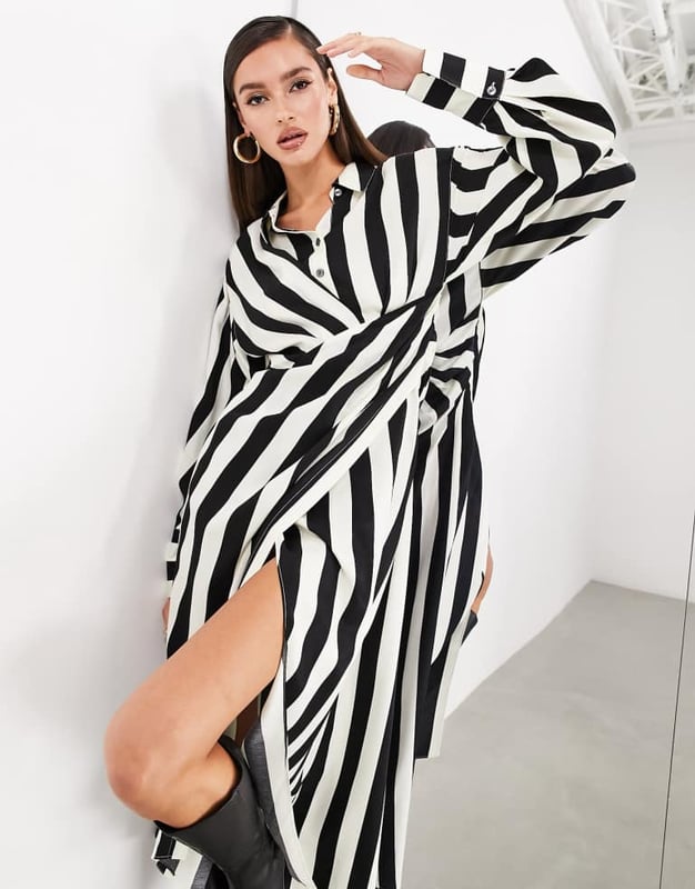 Dresses by ASOS EDITION POV: you have plans Spread collar Partial button placket Cut-out side Wrap skirt Buttoned cuffs Regular fitSold By: Asos