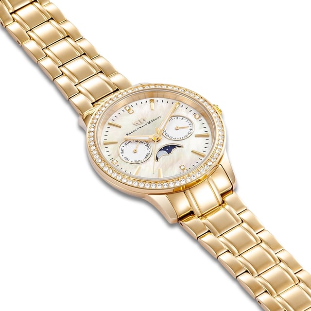 Would you like to enrich your watch collection with a model that combines multifunctionality and stylish glamor? Then this women's watch of the Rhodenwald & Sons label is an excellent choice. The design of the multi-layer dial is opulent and convinces with totalists for the weekday and date in the popular BICOmpax arrangement, striking line indices and night lighting. The moon phase display is striking. The robust stainless steel housing and the harmoniously coordinated limb strap are refined with an ion plate in yellow gold - for warm gold -gloss and best suitability for everyday use. Glamorous eyecatcher is the bezel, all around decorated with crystals from Swarovski®.