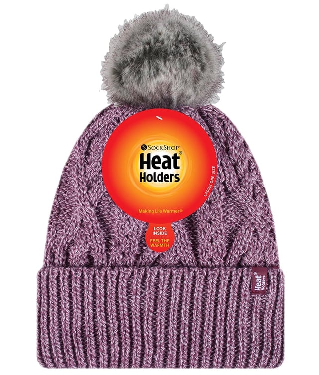 Like the original Heat Holders ladies pom pom but with a modern styled knit, this Solna styled hat like the original aims to keep you cosy and warm whilst keeping you fashionable with their contemporary style and knit. These womens pom pom hats have a fleece plush insulation lining, called Heatweaver, that is even more effective at holding warm air than any regular lining. This thermal lining is designed to be soft with a luxurious fleece feel (it almost feels like your touching the golden fleece) whilst holding warm air close to your skin, effectively keeping the cold air out. All of this is designed to ensure that you are toasty warm throughout the cold weather. This pom pom hat has a turn over cuff and a large faux fur fluffy pom pom on the top of the hat. This hat has a cable knit construction on its outer to give a fashionable touch. These ladies Solna hats are also to be considered the most slouch like out of all of Heat Holders’ range of thermal hats. These ladies Heat Holders Solna styled pom pom hats are available in 7 colours including cream, denim and light grey. They are made from 55% Polyester, 45% Acrylic on the outside of the hat and the lining is made from 100% Polyester. They come in one size and they are machine washable.