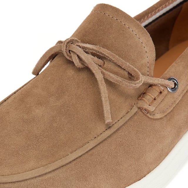 . A slip on shoe with suede uppers featuring decorative tassels across the vamp in brown suede and all over brown stitch details. Two silver branded eyelets situated on the outstep and instep with the signature BOSS logo embossed on the outstep of the heel. A textured rubber midsole in off white with a branded and textured rubber undresole in off white.
