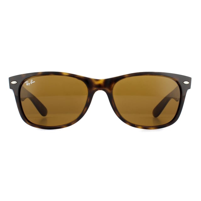 Ray-Ban Sunglasses New Wayfarer 2132 710 Light Havana Brown 52mm are an updated and slightly smaller interpretation of the Original Wayfarer. They feature a softer eye shape and sculpted temples that display the iconic Ray-Ban logo. The New Wayfarer 2132 are a versatile and playful choice that are available in countless colourways and the lightweight acetate frame is comfortable and easy to wear. The softer style of the 2132 suit more face shapes and is perfect for somebody that loves the Original Wayfarer design but is looking for a less dramatic look..