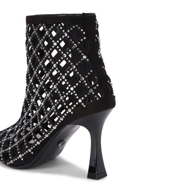 This Carvela Ankle Boot features a black microsuede upper with cut out details and silver crystals across the upper. The toe is pointed with an interior smoked lining and the heel is flared in design. Heel height: 8.5cm.