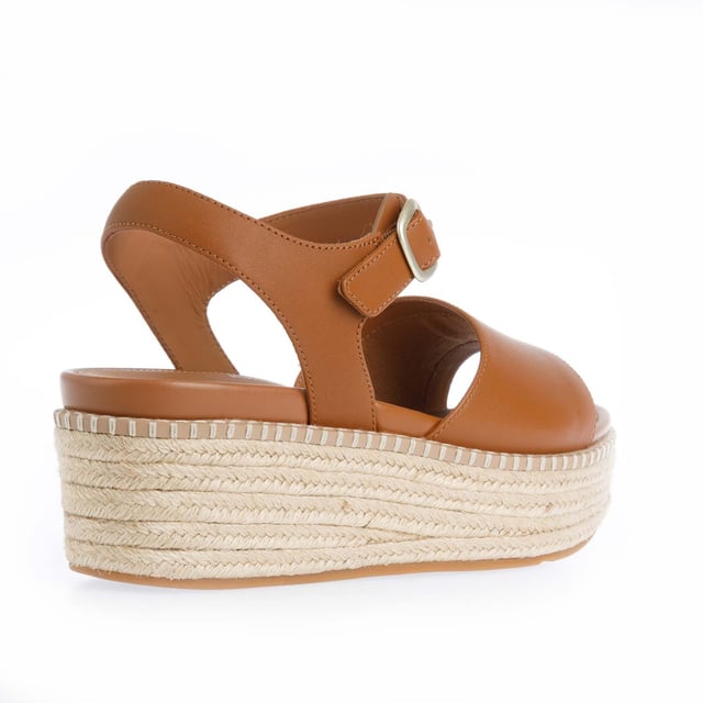 Womens FitFlop Eloise Espadrille Leather Back-Strap Wedge Sandals in light tan.Elevate your look - in every sense - with espadrille sandals on FitFlop's comfort-engineered high wedge sole.- Smooth high-quality leather uppers.- Lightly padded backstrap with adjustable buckle. - Comfortable cotton twill and leather-lined upper.- High wedge sole wrapped in natural jute for a laidback-chic summery vibe.- Statement stitching detail around the top of the sole.- Microwobbleboard midsole - absorbs shock  diffuses pressure and provides extraordinary comfort.- FitFlop branding to footbed.- Slip-resistant rubber outsole.- Average to wide fit.- Wedge height 2.8“ - 7.1cm approximately.- Leather and textile upper  Leather and textile lining  Synthetic sole.- Ref: HS5-592Measurements are intended for guidance only.