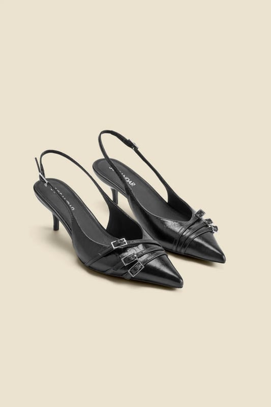 Introducing your AM to PM go-to shoesTimeless slingback style with a sleek pointed toeSet on a comfy-chic kitten heel Elevated with a statement buckle strap detail Adjustable strap for the perfect fit Dress them down with denim, up with