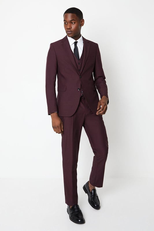 Slim, tailored fit for a sharp, modern silhouette
Two-button, single-breasted jacket with notched lapels
Sleek, streamlined design with minimal detailing
Premium, lightweight fabric with a hint of stretch
Versatile burgundy hue suitable for smart occasions

Exuding refined sophistication, this slim fit suit jacket from Burton is the epitome of contemporary tailoring. The sleek, streamlined silhouette hugs the body for a sharp, modern look that's perfect for smart casual events or formal occasions. Pair with tailored trousers and a crisp shirt for a polished ensemble that radiates confidence and style. The premium, lightweight fabric with a touch of stretch ensures a comfortable yet impeccable fit, allowing for ease of movement. Whether attending a wedding, business meeting, or evening soiree, this versatile jacket will have you looking dapper and on-trend.