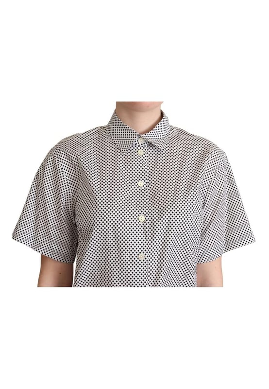 A estrenar con etiquetas.
  Confeccionado con algodon de la mejor calidad.
  Elegante estampado de lunares en tonos negros.
  Fabricado en Italia.
  Polo de manga corta con cuello.
  Presenta los detalles iconicos del logotipo de Dolce & Gabbana.
  Color: Neg.