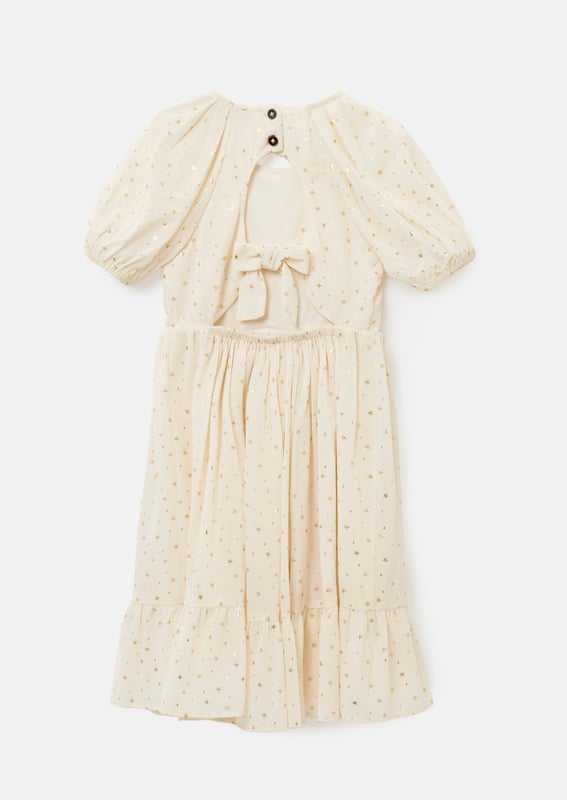 When you wish upon a star.. You get this stunning puff sleeve knee length dress with pretty open back detail scattered with gold foil stars. Heavenly... About Me: 100% Polyester. Look After Me: Think Planet. Wash At 30C.