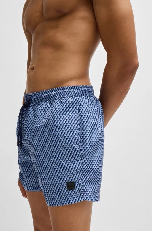 The model wears a size M and is 189 cm tall with a, 95 cm chest, 73 cm waist and 94 cm hips
50518968
Refined swim shorts by BOSS, designed with an all-over seasonal print. This fully lined pair is trimmed with a drawcord and logo label. This product is partly created with recycled polyester. We at HUGO BOSS prefer recycled polyester from pre- and post-consumer textile waste and do our best to phase out polyester from PET bottles. The aim of using recycled materials is to save valuable resources.