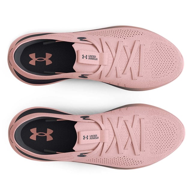 Womens Under Armour Flow Synchronicity Running Shoes in pink.- Soft  textured knit upper.- Lace up fastening.- Knit ankle collar & heel design.- Plush sockliner cradles.- One-piece Flow midsole provides responsive & long-lasting cushioning.- We used 3D foot scans to create a customized  women's-specific build for superior fit & feel.- Flow technology eliminates the rubber outsole  creating a more lightweight & seamless ride on any surface.- Ref: 3024786600