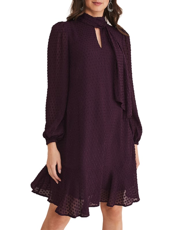 Elevate your wardrobe with the luxurious Everly Swing Dress - a textured piece in a rich plum shade perfect for any casual occasion.