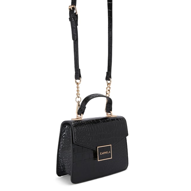 This Jessica Top Handle Bag features a black exterior with large croc print. There is a gold branded plate on the front flap.15cm (H), 17cm (L), 7cm (D). Strap length: 125cm. Gold tone chain strap with two inserts.