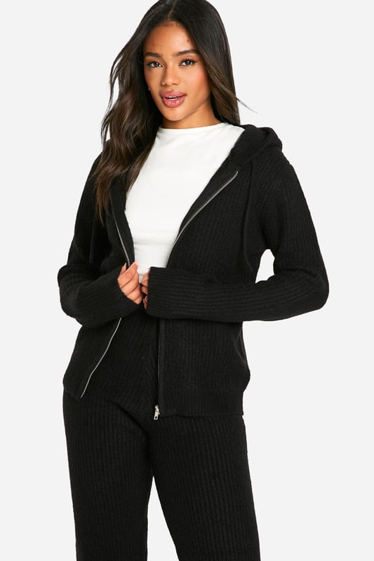 Soft fine knit texture for ultimate comfort
        Zip-through hoodie design for versatile styling
        Coordinating trousers for a complete look
        Ribbed cuffs and hem for a snug fit
        Relaxed silhouette perfect for lounging or casual outings
    
    Embrace laid-back chic with this soft fine knit tracksuit from Boohoo. The zip-through hoodie and coordinating trousers offer a seamless blend of comfort and style, ideal for those lazy weekends or casual catch-ups with friends. Layer the hoodie over a simple white tee, as shown, for a classic look, or wear it zipped up for extra warmth. The relaxed fit allows for easy movement, making it perfect for running errands or lounging at home. Pair with trendy trainers and a crossbody bag for an effortlessly cool ensemble. For a touch of athleisure, style with statement socks and slider sandals. This versatile co-ord set is a must-have addition to your casual wardrobe, offering endless styling possibilities for the fashion-forward Boohoo girl.