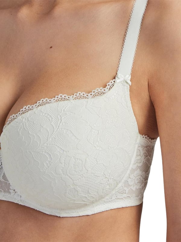 Aubade Roseessence Moulded Half Cup Bra. T-Shirt style with elastic lace trim and band. With elastic straps and an elastic tulle. Finished with Swarovski jewel. The product is hand-wash only.