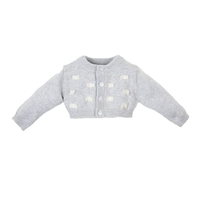 Tricot knit jacket.
 Round neck.
 Button closure on the front.
 Long sleeve.
 Thread embroidered details on the front.
 Seams seen in tone.
 Composition: 75% Cotton, 20% Polyamide, 5% Wool
 Care:
- Wash maximum at 30ºC.
 - Iron at medium temperature, max. 110ºC.
 - It is not allowed to use a dryer.
 - Do not use bleach.
 - Does not support dry cleaning.