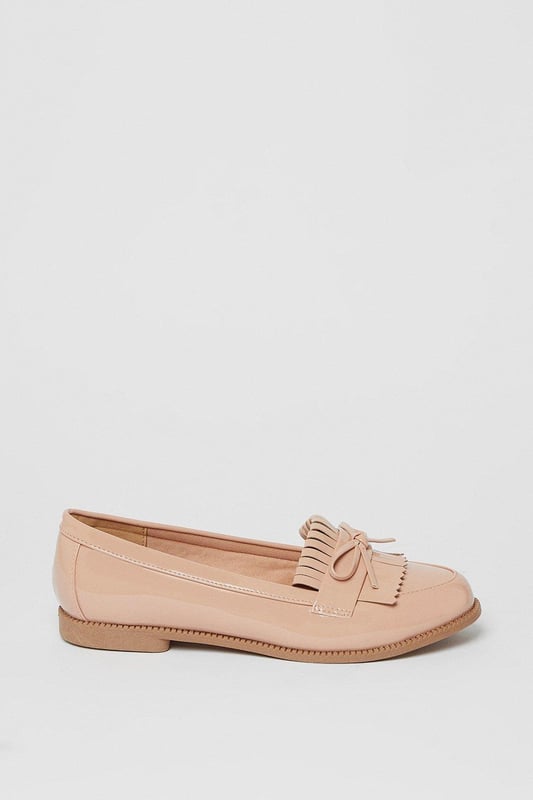 Faux leather loafers with a wide fit for added comfort
Stylish tassel detailing adorns the vamp
Moccasin-inspired stitching adds a touch of flair
Flat heel offers all-day wearability
Versatile design suitable for day-to-night occasions

Effortlessly transition from desk to dinner with these chic wide fit loafers from Dorothy Perkins. The faux leather construction exudes a polished look, while the tassel embellishments and moccasin-inspired stitching lend a touch of playfulness. Pair them with tailored trousers for a sophisticated workwear ensemble, or team them with a flowy dress for a casual yet refined weekend brunch look. With their flat heel, these versatile loafers offer all-day comfort, making them an ideal choice for any occasion.