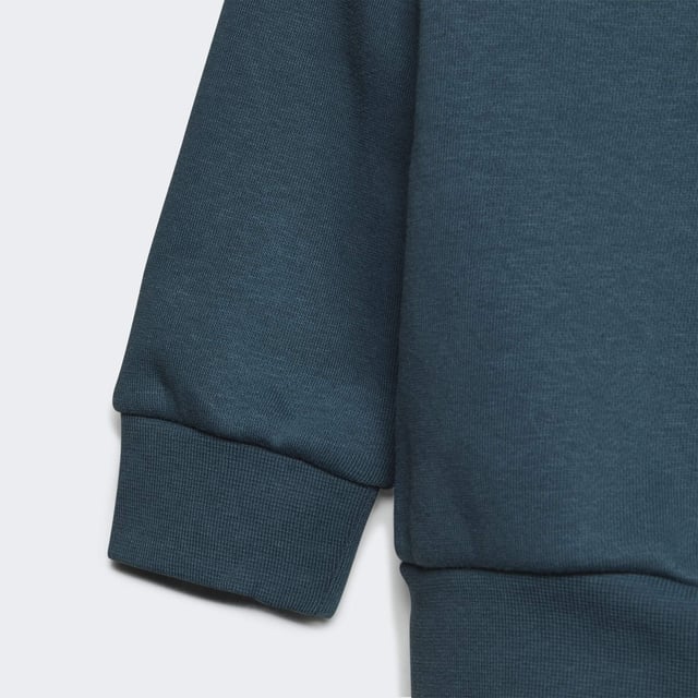 Your little one was born to explore. This infants' crew set was made to keep them comfy on every adventure. Fleece fabric cradles them in softness from head to toe. Trefoils on the front and side keep the look authentically adidas.adidas' cotton products support more sustainable cotton farming.  - Regular fit - Sweatshirt: Ribbed crewneck with button placket (up to size 86) - 70% cotton, 30% polyester (recycled) - Sweatshirt: Ribbed cuffs and hem - Pants: Medium rise - Pants: Drawcord on elastic waist - Supports the Better Cotton Initiative - Pants: Side pockets  Shipped by adidas