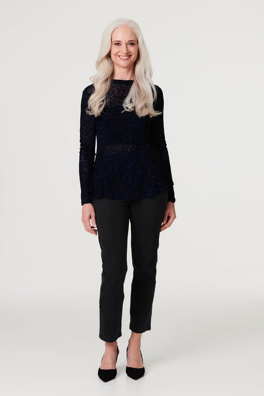 Stand out from the crowd in this delicate lace print peplum mesh top. With a high round neck, long sleeves, a high low hem and a sheer mesh fabric. Style with a cami top, high waist trousers and heels for an elegant evening look or be daring by layering over a bralette and high rise faux leather trousers and heels for cocktail hour.
