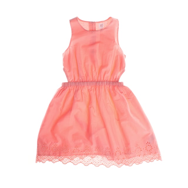 This charming little girl's dress made of soft cotton is not only cool and comfortable, but also features details that make it special. It is perfect for sunny days or special events.

 The design includes openings at the waist, which add a modern and unique touch, allowing greater ventilation and a more casual style.

 The elasticated waist ensures a comfortable and flattering fit, while the skirt, adorned with delicate floral embroidery at the hem, gives it a feminine and elegant touch.

 At the back, the dress has a button closure, making it easy to put on and adding a decorative touch.

 In addition, the dress has an internal lining, which ensures greater opacity and comfort, making the garment ideal for all day, allowing girls to move freely without sacrificing style or practicality.

 This dress is ideal to combine with sandals or sneakers, offering a cheerful and charming look for any occasion.
 Composition: Shell: 100% Cotton; Lining: 100% Polyester
 Care:
- Machine wash cold.
 - Use mild detergent.
 - Do not use a dryer.
 - Iron at low temperature.
 - Do not dry clean,