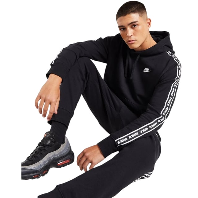 Nike Aries Club Tape Mens Pullover Hoodie In Black Freshen up and step out in this men's Aries Hoodie from Nike. In a Black colourway, this regular-fit pullover is made from a soft cotton and poly blend for lasting comfort. It has a drawcord-adjustable hood for custom coverage, stretchy ribbed trims to hold the shape and a kangaroo pocket for your essentials. Finished up with taped Nike branding down the sleeves and a Nike Futura badge embroidered to the chest.