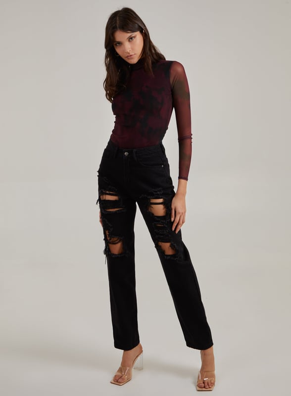 This Smudge Print Bodysuit is all you need to make a statement. Pair with knee high boots and distressed jeans for a killer look.