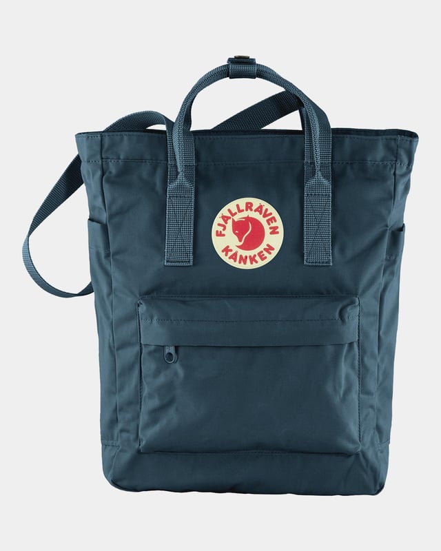 Fjallraven Kanken Unisex Totepack Unisex Kånken Totepack
Kånken Totepack is a convertible version of Fjällräven’s iconic backpack and can be either a backpack when you bike or a shoulder bag when you board a crowded bus. It has a zippered main compartment and an inside pocket with a padded base for a 13” laptop. With the seat pad you’ll find in the back of the main compartment, you can always take a break, wherever you are.
Made from durable, water-resistant G-1000 HeavyDuty S.
Top-loaded main compartment with zipper.
Inside laptop sleeve with padded base (up to 13 inches).
Zippered front pocket and open side pockets.
G-1000® HeavyDuty S: 65% polyester (recycled), 35% cotton (organic)
Organic cotton, Recycled polyester, Produced without PFCs
Inside compartment, Open outside pocket(s), Zippered outside pocket(s)
Adaptable with Greenland Wax, Durable, Quick-drying, Water resistant, Wind resistant
Clean with soft brush and lukewarm water
F23710