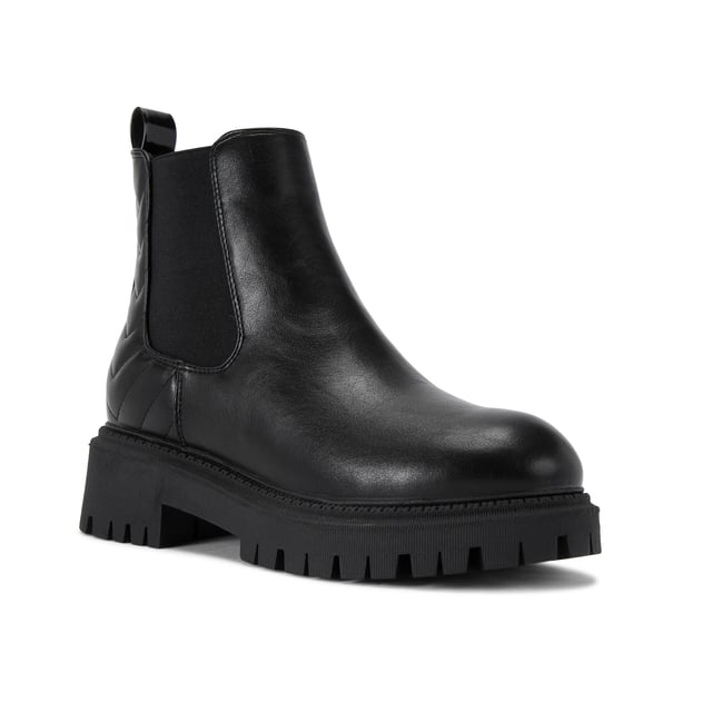 This Carvela Ace Chelsea ankle boot features a black upper with chevron overstitch quilting at the back of the ankle. There is a crystal stud at the back of the ankle with a small patent pull tab.
