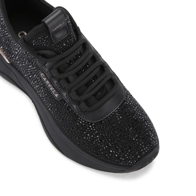 This Carvela Swift Jewel Runner trainer features a black fabric upper with black crystal embellishment. The front laces up with gold foil branding on the tongue and eyestay.