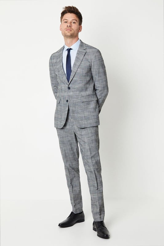 Tailored fit suit jacket crafted from a cotton-blend fabric
Half-lined construction for a lightweight and breathable wear
Notched lapel collar exudes a timeless, sophisticated aesthetic
Single-breasted design with a two-button closure
Flap pockets at the front add a functional touch

Effortlessly elevate your formal attire with this tailored suit jacket from Burton. Designed to flatter the masculine silhouette, it features a well-balanced fit that defines the shoulders, chest, and arms while allowing for ease of movement. Pair it with matching trousers and a crisp shirt for a polished ensemble suitable for smart casual events, business meetings, or evening soires where you want to make a refined impression.
