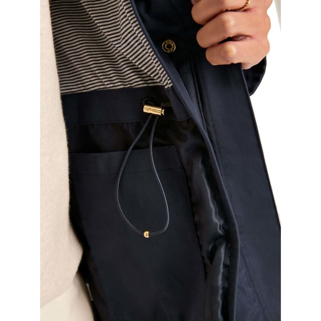 A practical and stylish addition to our Right as Rain collection, the Portwell raincoat is a true wet-weather essential. To ensure you will stay dry in any downpour, it's waterproof with fully taped seams. Other weather-beating details include an adjustable hood with storm peak and a stom flap to the back which allows droplets to roll away from the back of the coat. An adjustable waist with internal toggles allows you to cinch the coat in for a flattering fit, while a concealed zip and popper fastening creates a clean, sleek finish. It's completed with front pockets with popper fastenings, adjustable cuffs and a half-body lining.