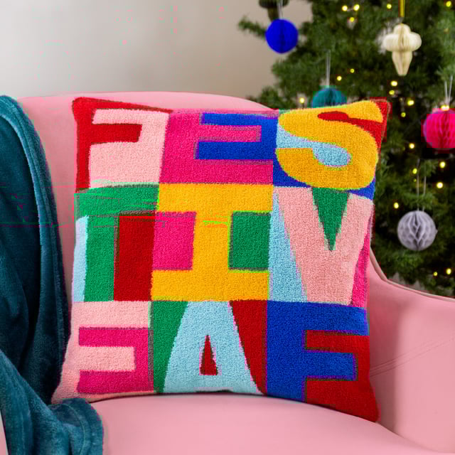 Get into a 'Christmassy' mood with this vibrant knitted loop tufted cushion. Woven in a range of fabulous techno colours and paired with a fuchsia pink velvet reverse; This unique design is the perfect addition for those who love all things colour!  Size: 43 x 43cm