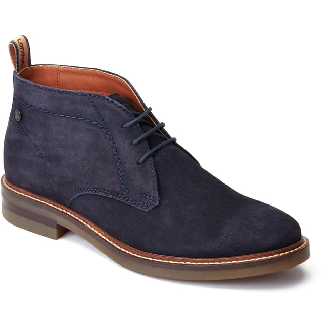 Stride in style with the Knebworth Men's Chukka Boot by Base London. Boasting premium leather uppers, a laid-back 3-lace closure, and a robust nylon pull tab for easy on/off, this Chukka boot features an Orthorlite insole for added comfort.