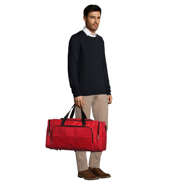 Large main compartment. Zipped pockets at each end. Zipped front pocket. Carry handles with pad. Adjustable/removable shoulder strap. Baseboard. Studded base. Material: 600D polyester. Dimensions: 30 x 56 x 26 cm.