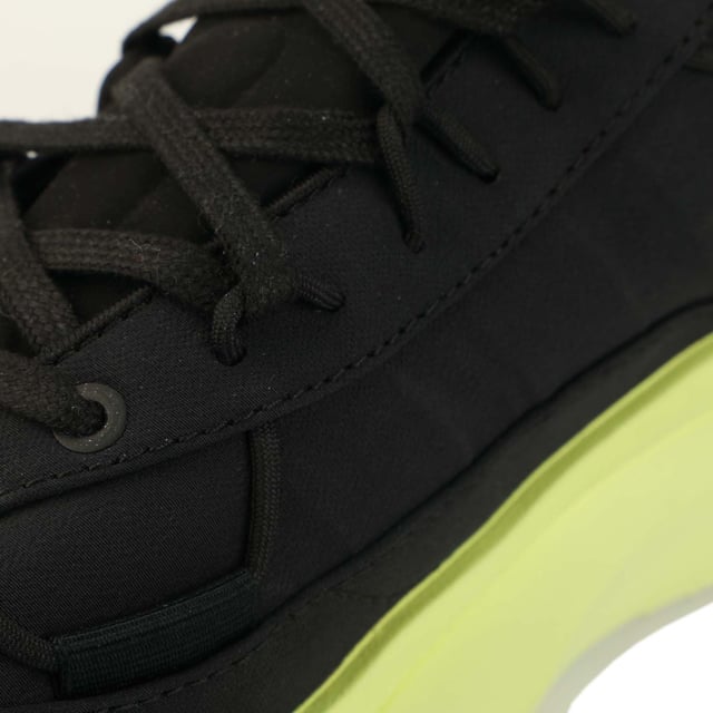 Mens Y-3 Shiku Run Trainers in black yellow.- Leather upper.- Lace closure.- Padded ankle.- Tonal pull-tab.- Round toe.- Contrasting printed logo on the tongue.- Embossed logo on the inside.- Moulded sole.- Ref: GZ9139