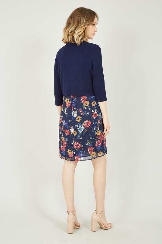 Layer up with this Navy Knitted Bolero for those cooler summer nights. Finished in a luxuriously soft feeling, navy colour. This little number is perfect to layer over a sleek dress for a fancy event to keep you looking sophisticated, or over a pretty floral number for the cooler summer nights. To complete your chic look, wear this cardigan with a floral dress, sandals and sunglasses.