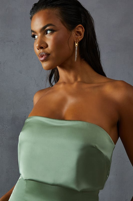 Elegant bandeau neckline with overlay detail
        Figure-hugging silhouette for a flattering fit
        Floor-length design perfect for formal occasions
        Luxurious satin fabric for a sophisticated look
        Sleek, strapless style to showcase your shoulders
    
    Make a striking entrance at your next formal event with this stunning bandeau overlay bridesmaid dress from MissPap. The sleek, strapless design features an elegant overlay detail that adds a touch of sophistication to the classic silhouette. The figure-hugging cut accentuates your curves, while the floor-length style ensures a dramatic sweep as you move. Perfect for weddings, galas, or any black-tie affair, this dress is versatile enough to be styled for various occasions. Pair it with strappy heels and statement earrings for a glamorous look, or opt for a delicate necklace and understated clutch for a more refined ensemble. The luxurious satin fabric catches the light beautifully, ensuring you'll shine throughout the evening. Whether you're a bridesmaid or a guest, this dress is sure to turn heads and make you feel like the belle of the ball.