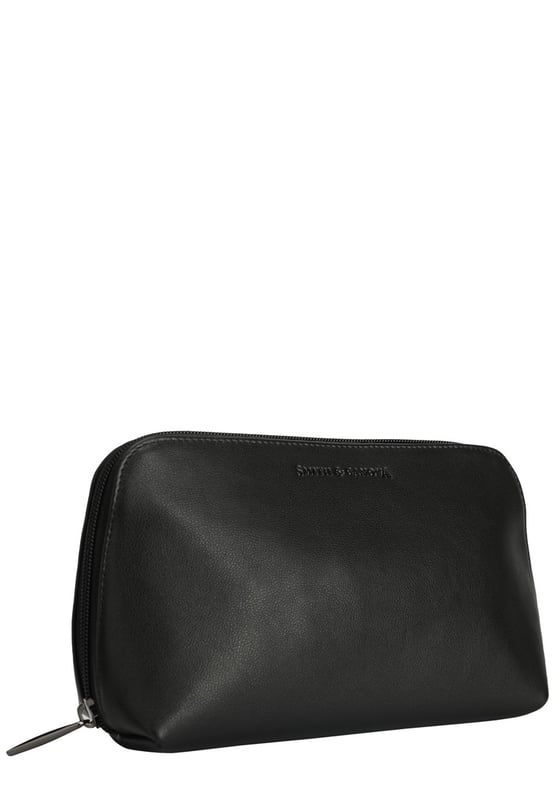 This staple zip around cosmetic bag in genuine leather, inside features a zip pocket, elasticated pocket and elasticated cosmetic holders. This minimal design includes a debossed logo and gunmetal zip pull. Features: , Zip around fastening, Smith & Canova debossed logo, Smith & Canova branded interior, Inner zip pocket, Elasticated pocket, Genuine Leather Style Ref: 26833 BLACK