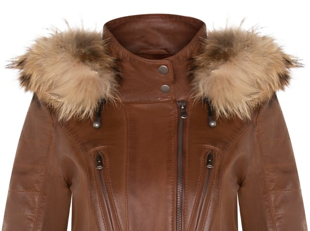 Elevate your winter wardrobe with our slim-fit Women's Leather Parka Jacket, a perfect choice for staying warm and stylish in colder weather. Crafted from 100% premium ultra-soft nappa leather, this jacket offers a luxurious and comfortable feel. Here's what sets it apart:

Detachable Fur-Lined Hood: The jacket features a detachable fur-lined hood, providing both warmth and an exuberant look that adds a touch of sophistication to your winter attire.
Functional Zip Pockets: Four zip pockets on the jacket front, tabbed for easy opening, offer secure and convenient storage for your essentials.
Luxurious Quilted Detailing: Quilted detailing on the sleeves and waist adds a touch of luxury and texture to the jacket's design, enhancing its visual appeal.
High Stand Collar: The high stand collar, fastened with press studs, not only keeps you warm but also adds a chic and elegant element to the overall look.
Zipped Cuffs: Zipped cuffs provide added adjustability and style, allowing you to customize the sleeve length according to your preference.
This Women's Leather Parka Jacket combines fashion, functionality, and premium quality, making it a must-have addition to your winter wardrobe for a chic and cozy look.