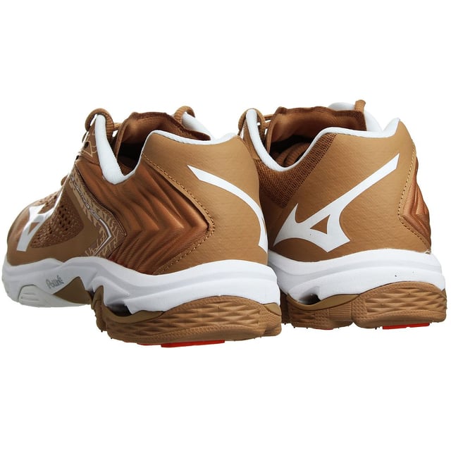 The Mizuno Wave Lightning Z5 Men's Brown Trainers are a high-performance footwear option designed for athletes, particularly for sports like volleyball. These trainers feature a stylish brown color, offering a unique and sophisticated look on the court. Known for their advanced technologies and lightweight construction, the Mizuno Wave Lightning Z5 Men's Trainers are crafted to provide athletes with the support, stability, and agility they need to excel in their game.

Key Features:

 Mizuno Wave Technology:  The trainers are equipped with Mizuno's signature Wave technology, providing exceptional cushioning and stability during dynamic movements.

 Volleyball-Specific Design:  These trainers are tailored for volleyball players, offering features that enhance responsiveness and support for quick actions on the court.

 Lightweight and Flexible:  Made with lightweight materials, these trainers minimize bulkiness and promote agility, allowing athletes to move freely.

 Breathable Upper:  The trainers come with a breathable upper, ensuring proper airflow to keep feet cool and comfortable during intense matches.

 Secure Fit:  The trainers feature a lace-up closure system, allowing for a secure and customized fit.

 Durable Construction:  Constructed with high-quality materials, these trainers are designed to withstand the demands of intense gameplay.

 Mizuno Branding:  As part of the reputable Mizuno brand, these trainers represent a mark of quality and expertise in sports footwear.

Please note that product details and color options can vary based on region and availability. To confirm the exact features and color availability of the Mizuno Wave Lightning Z5 Men's Brown Trainers, I recommend checking the official Mizuno website or authorized retailers for the most up-to-date information.