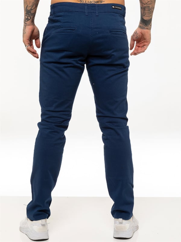 Indulge in the ultimate comfort and style with our ENZO Mens Designer Skinny Fit Chino Pants. Featuring a sleek zip fly fastening, two front pockets, two back welt pockets, and the signature Logo Branding on the Back Waist Patch