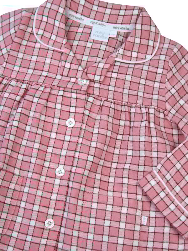 Our girls peony pink cotton pyjama set is where comfort meets feminine elegance. Made from soft and breathable cotton, these pyjamas are perfect for a restful night's sleep or lounging in style. The delightful peony pink check design adds sophistication to bedtime, making it a lovely experience for your little girl. Let her embrace a blend of comfort and fashion with these classic pyjamas, designed for a cosy nights and fashionable lounging.
